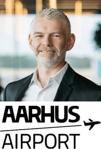 David Surley with Aarhus Airport logo