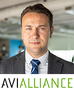 Martins Tamovics with AviAlliance logo