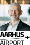 David Surley with Aarhus Airport logo